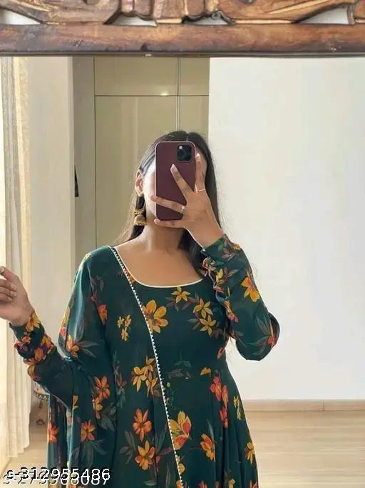 Rich green anarkali dress with a floral pattern, long sleeves