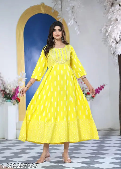 Yellow floral kurta with traditional design, long sleeves, embroidered details, perfect for festivals