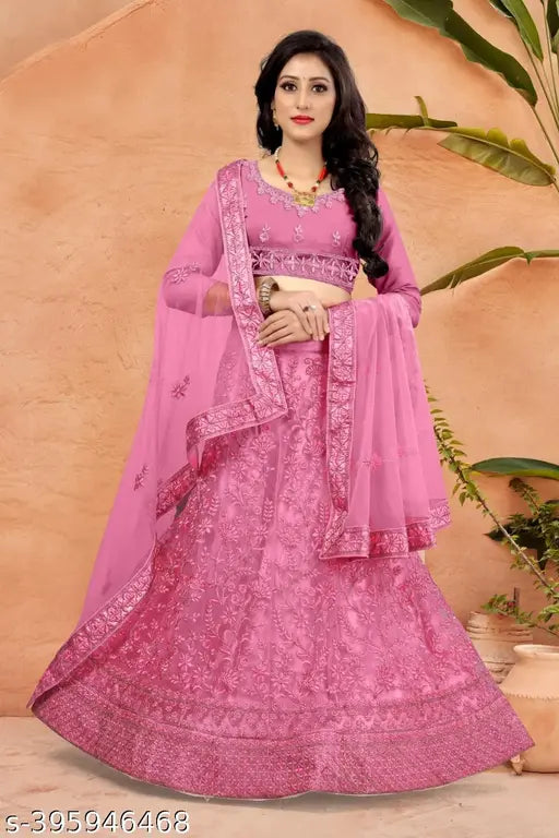 Embroidered Pista-colored net lehenga, choli, and dupatta with zari and dori work, Indian wedding attire on display