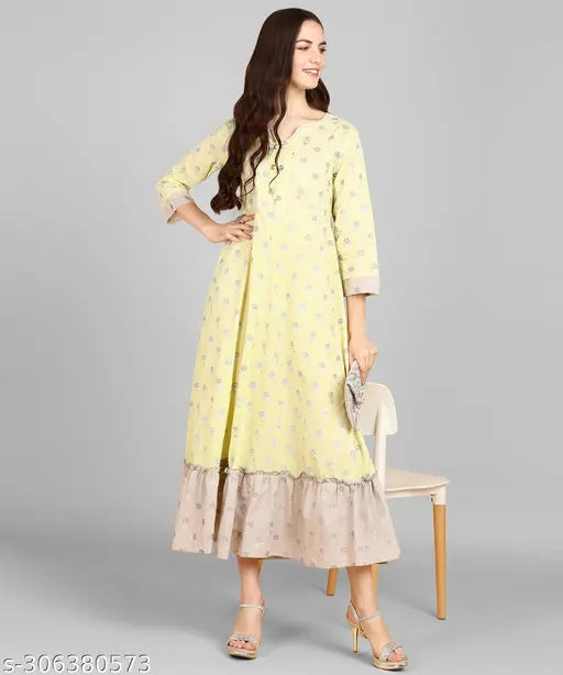 Light yellow polyester cotton printed A-Line kurta with 3/4 sleeves and sweetheart neck, embellished with zari work. Impressive traditional style from Adhisa, originating in India