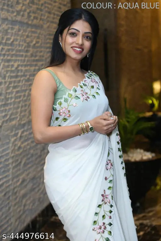 Aqua blue silk saree with white floral embroidery