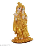 Resin Radha Krishna statues with gold accents, diya, and black tray. Indian decorative murti combo for home or temple decoration