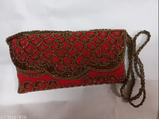 Red beaded clutch with gold accent, small size, likely handbag