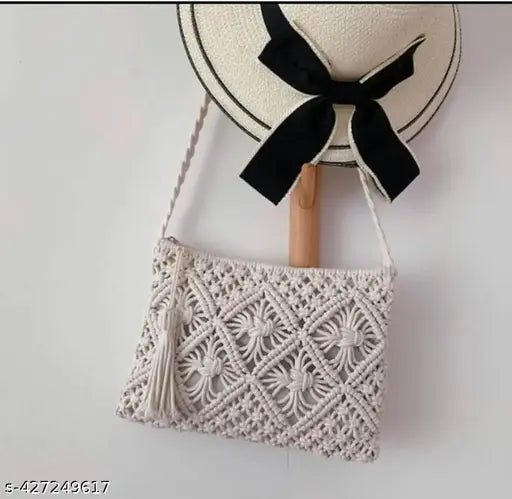 Off-white handcrafted crossbody sling bag with macramé pattern and braided straps, ladies' accessory for daytime outings or casual shopping trips