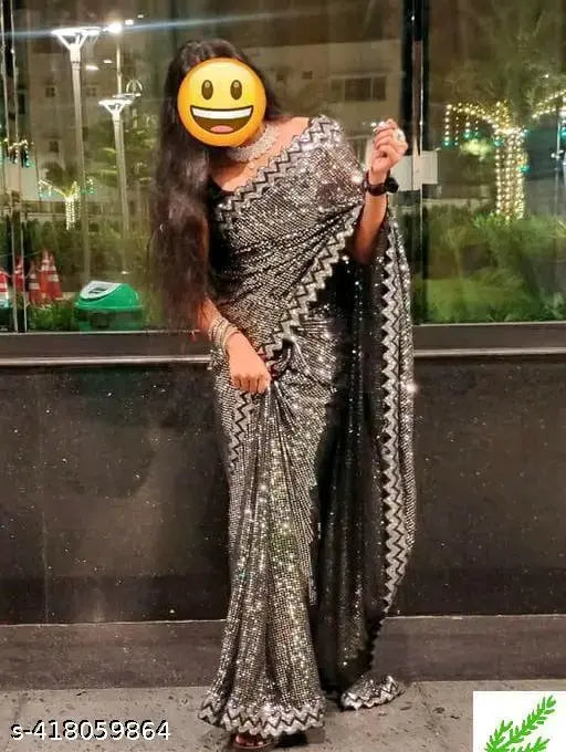 A long, patterned saree with a black border
