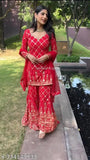 Red and gold embroidered party wear look for women, including dupatta set