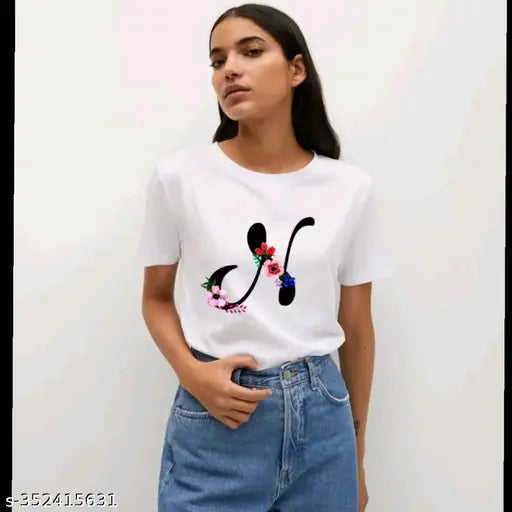 Black flower and alphabet design women's half sleeves printed polyester t-shirt, featuring intricate print on short sleeves, size M for bust 34in and length 24in. Made in India