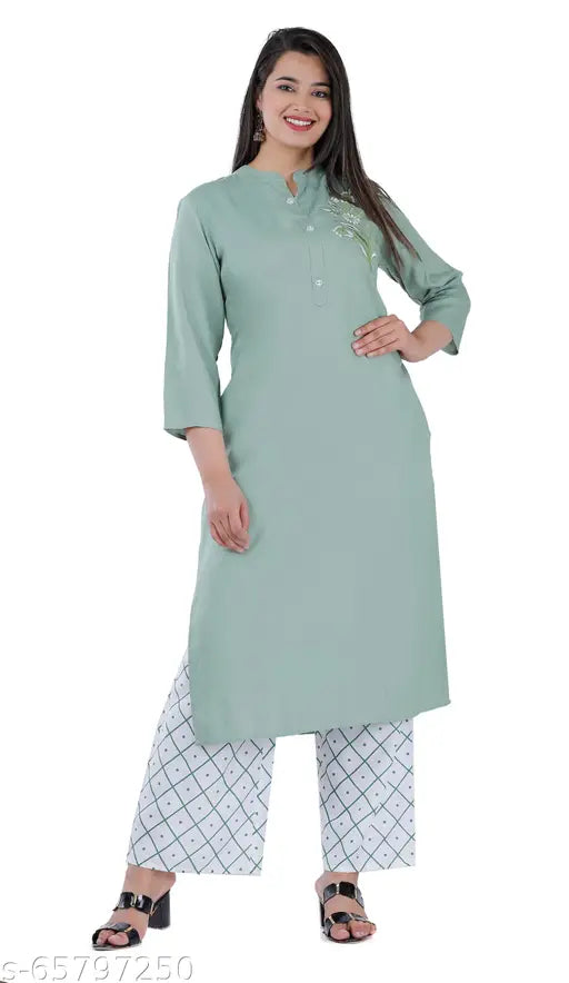 Pista color embroidered rayon kurta with rayon palazzo set, three-quarter sleeves, Indian handcrafted embroidery on display