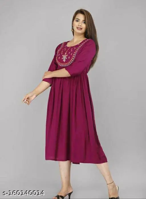 Embroidered rayon women's wine kurta, three-quarter sleeves, vibrant Indian fashion on hanger