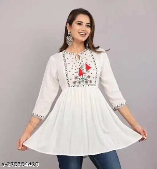 White Rayon Pleated Kurti with Ethnic Embroidery, Indian stitched kurti with round neck and three-quarter sleeves, embellished with intricate embroidery patterns