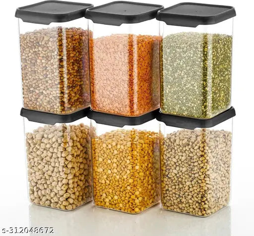 Transparent, black plastic container set with multiple compartments containing grains and legumes