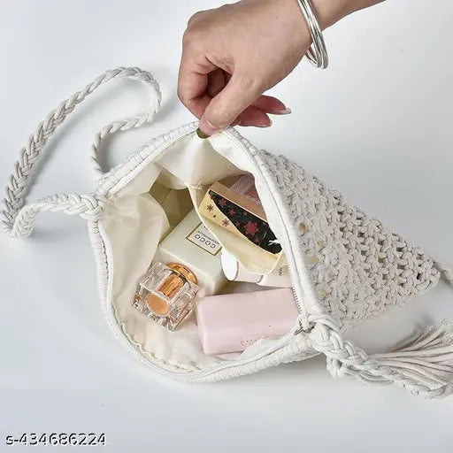 White fringe crossbody bag with intricate knots, festival style