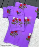 Purple georgette party wear saree with red flowers and white lace trim