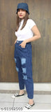 Womans blue jeans, casual crop top, black high-top sneakers