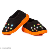 Black and orange shoe with multi colored dots, possibly neoprene or rubber material