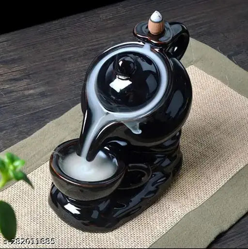 Black polyresin kettle & cup design incense holder with 10 scented cones. Handcrafted feng shui decor for positive energy at home