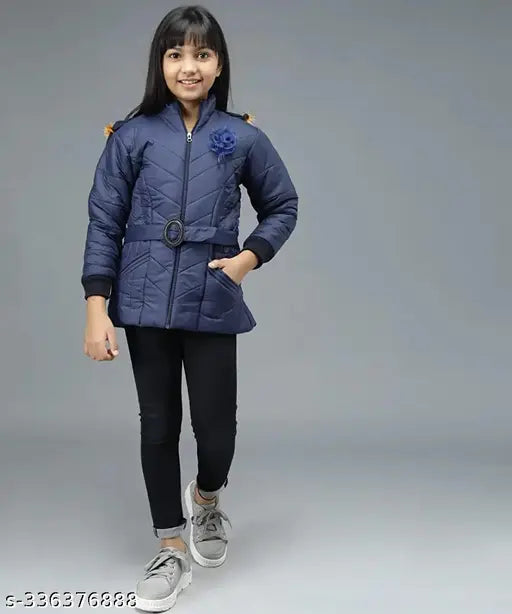 Girl in blue bomber jacket, white shoes, black pants, smiling