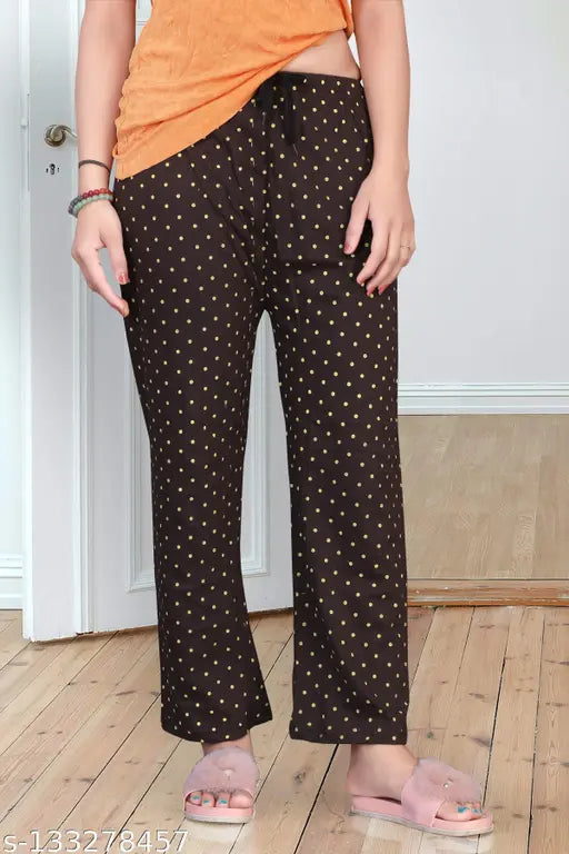 Orange jogging pants with black polka dot pattern