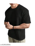 Men's cotton blend oversized dropshoulder T-shirt in solid round neck design, perfect for casual wear. Soft, breathable, and durable material for long-lasting comfort. Available in various colors and patterns. Made in India