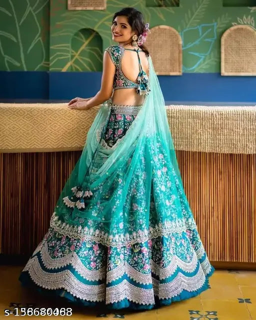 Teal foil applique lehenga set aqua blue - embroidered silk and net Indian bridal wear with choli and dupatta on display stand