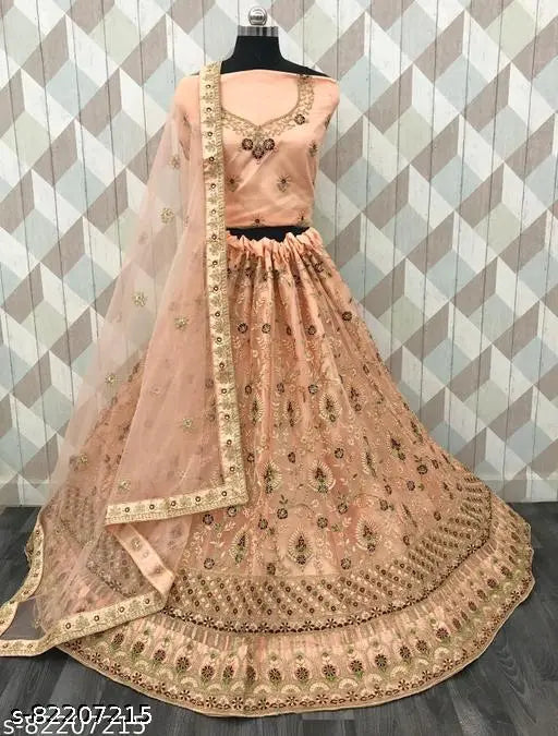 Peach net Lehenga Choli with embroidered top, bottom, and dupatta. Free size, 42m waist, 42m length, 2.5m dupatta length. Quality fabric for regular occasions or gifts