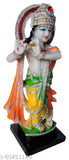 Resin Lord Krishna statue for puja gift, 11 cm length, 31 cm height, 10 cm breadth. Handcrafted with white marble finish, multicolor dressed Krishna idol playing Murli on wooden log