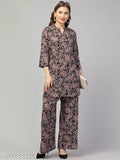 Black multi-printed rayon top with palazzo set for women, features three-quarter sleeves and soft, lightweight fabric. Perfect for various occasions, machine washable, made in India