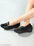 Stylish black women's heeled pumps with a wedge design, slip-on, featuring Bellies Shoe brand, 3/4 length