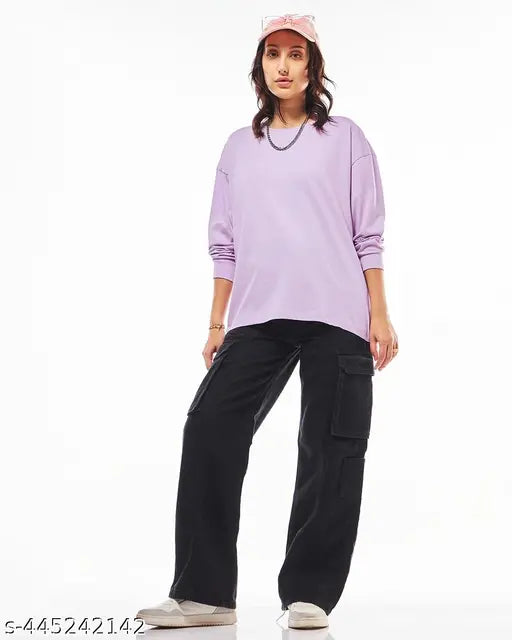 A woman wearing a purple long-sleeve t-shirt