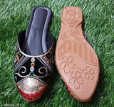 Patent leather colorblocked Indian sandals by Stylist Rajwadi Bantu on display rack