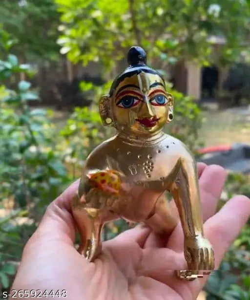 Hand-painted brass Krishna idol, modern Laddoo Gopal statue with intricate netr shringar and gold color finish. Perfect for home decor or office table sculpture during Janmashtmi festival, Hindu religious celebrations. (8*5*8 cm) Made in India