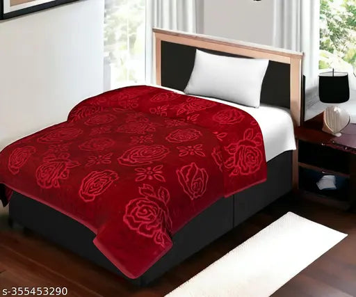 Red patterned comforter with floral design, king size