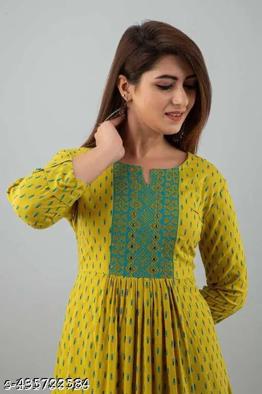 Rayon printed yellow Anarkali kurti with embroidered three-quarter sleeves and flared silhouette, ideal for casual occasions. Available in sizes S-XXXL