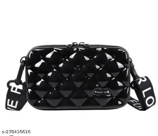 Black colored, shiny, boxed, bubble patterned style mini handbag with a thin strap
