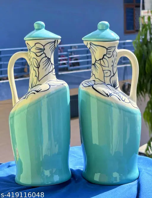 Green ceramic oil dispenser with lid, ideal for kitchen storage