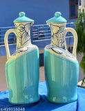 Green ceramic oil dispenser with lid, ideal for kitchen storage