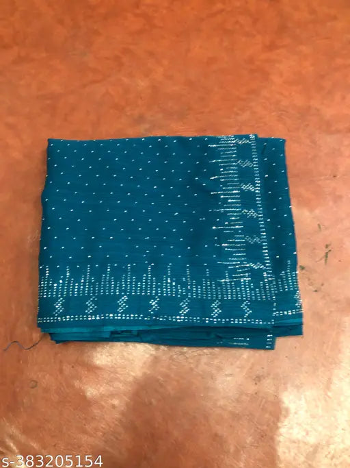 Geogrette patterned fabric, likely sari material, with a shiny appearance