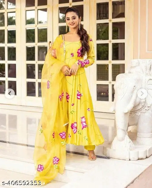 Yellow Georgette gown with printed net, three-quarter sleeves, from India. [Anira] [yellow georgette] [printed net maxi dress]