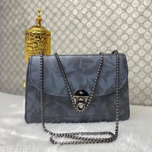Gray faux leather sling bag with chain details, suitable for casual outfits