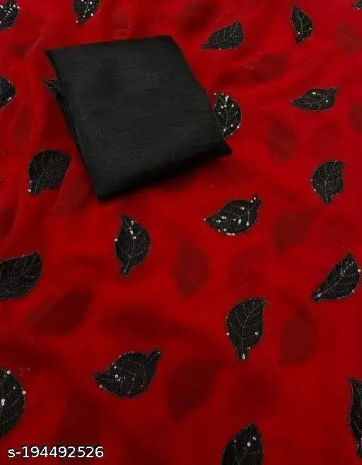 Red fabric, likely silk, with patterned leaves
