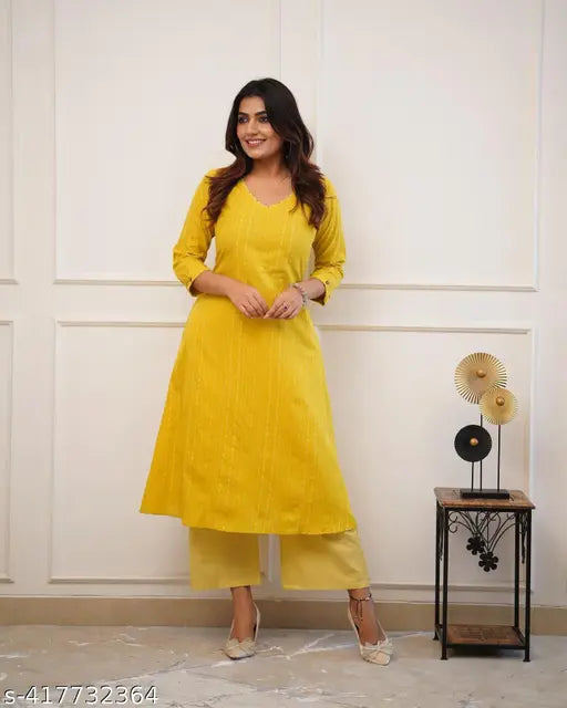 Striped stripe cotton kurta set with palazzos, three-quarter sleeves, rayon sleeve detail - Indian handloom clothing on display