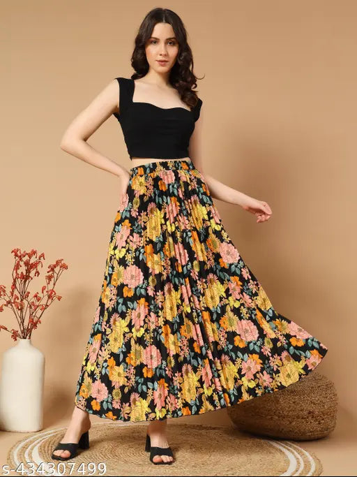 Black floral pleated maxi skirt with pockets, perfect for any occasion. High-quality crepe fabric. Available in sizes 26, 28, 30, 32, 34, 36, 38 (waist: hips). Indian origin
