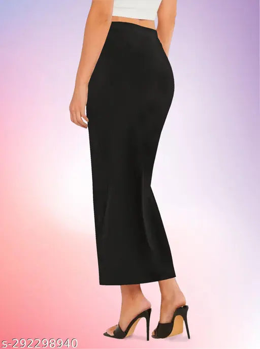Casual black high waist skirt with elastic band and side slit in polyester blend material. Approximately 32.5 inches length