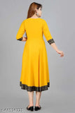 Yellow kurta with black designs, long sleeves