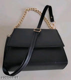 Black leather shoulder bag with gold chain straps and zip closure