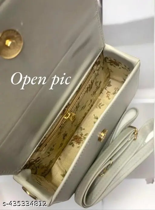 Open sling bag with crossbody strap, sleek design, goldtone hardware