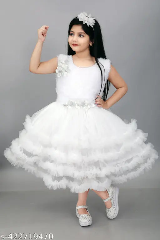 White lace child's dress with bow in hair