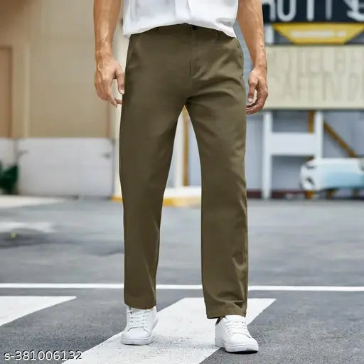 Solid brown cotton trousers for men, size 28-36, on a clothing rack