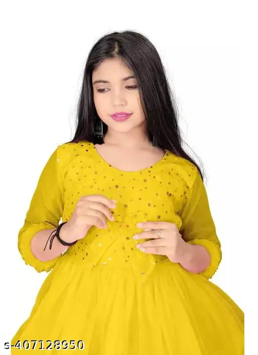 Stylish net children's dresses, solid pattern, three-quarter sleeves. Elevate your kid's wardrobe with New Gowns from B. R. Enterprise. Perfect for parties and events, sizes range from 5-16 years old, origin: India