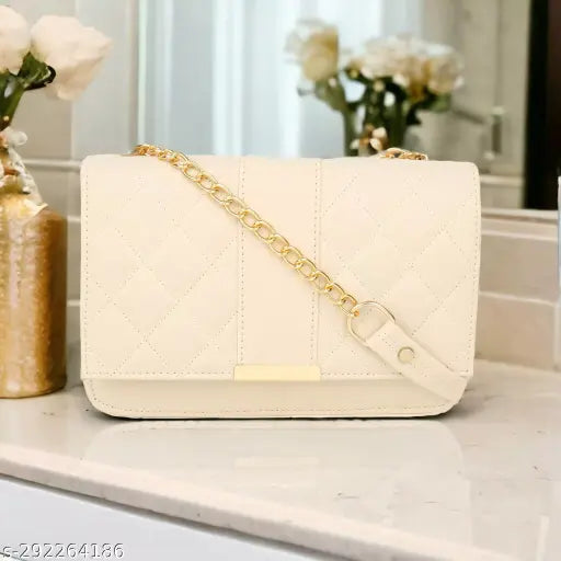 Tan quilted women's sling bag with a shoulder strap and two main compartments